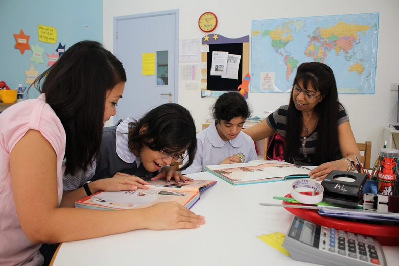 Employees teaching kids