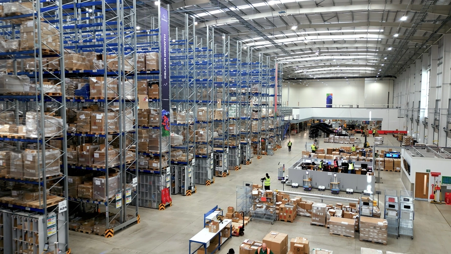 Interior of a large DP World warehouse with organized inventory systems