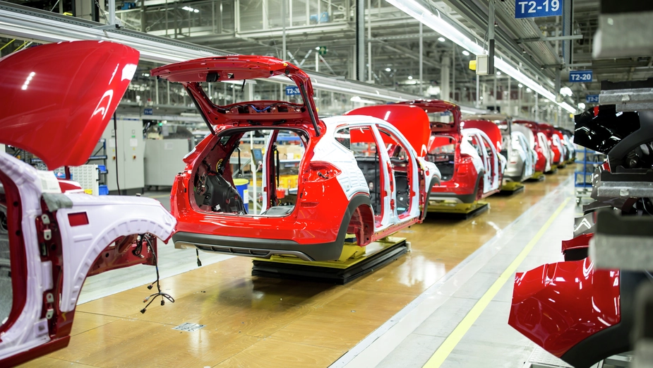 Cars on a factory assembly line